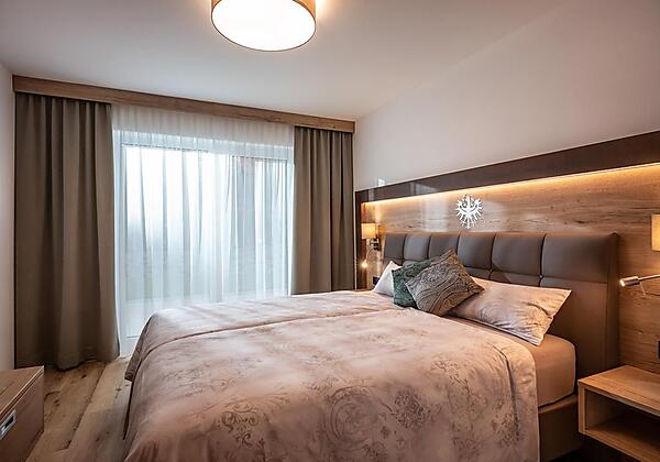 Söll_APARTdeluxe_Schlafzimmer_Ferienwohnung_Wilder