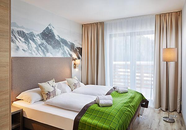 Alpenwohnen.L - Schlafzimmer - Wohnbeispiel