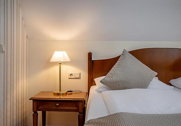 Einzelzimmer mit Queensizebett